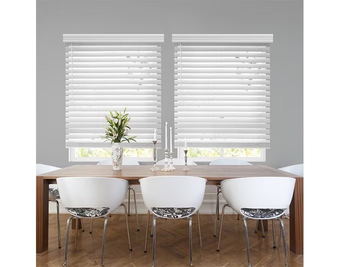 White custom blinds installed in a home office