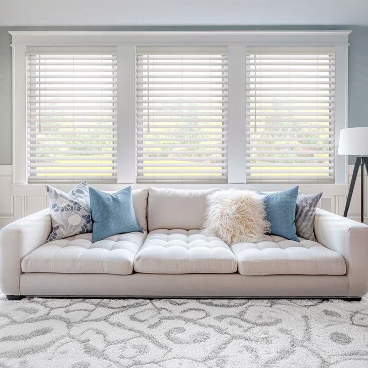 White custom blinds installed in a bedroom